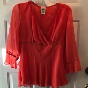 Orange top with ruffled bottom